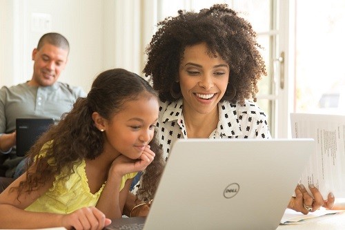 woman and child using a laptop